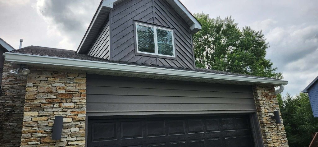 Gutter installation on stone facade home Baltimore